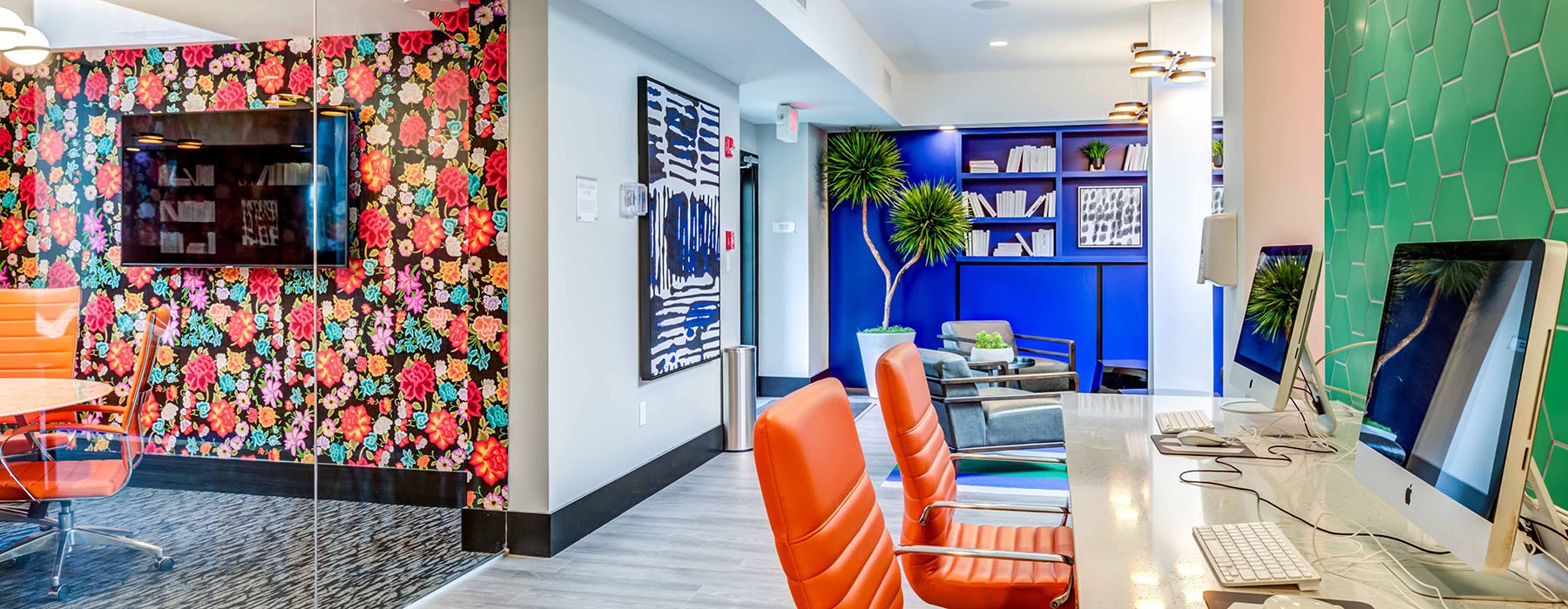 modern business center with colorful decor and a private meeting space